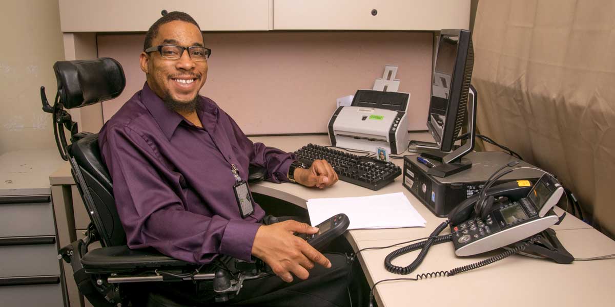 Man at desk using computer