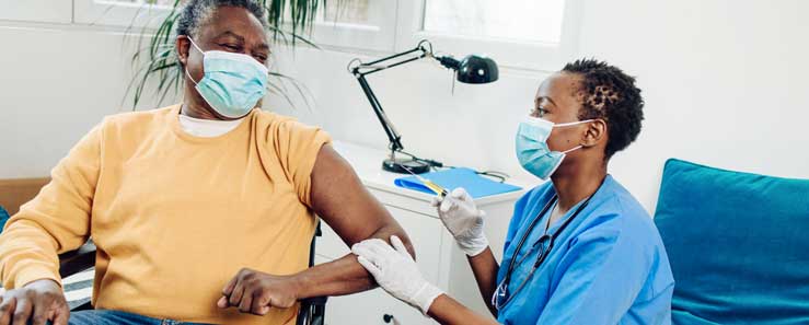 Man receiving covid-19 vaccine